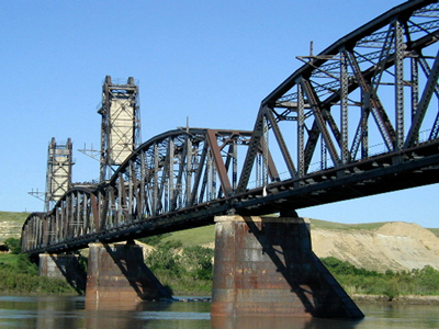 fairview bridge with water under and rust covering bridge