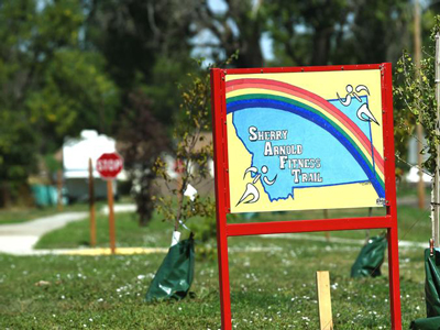 sidney arnold trail sign on green grass